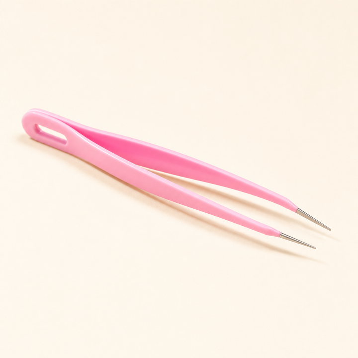 Pink precision tweezers for placing mini fuse beads